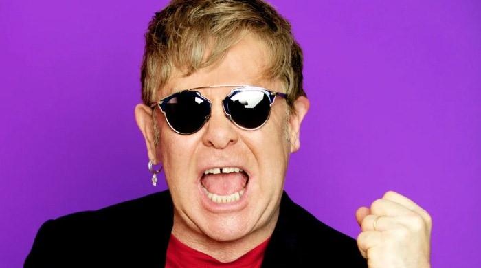 Elton John snaps while recording ‘Who Believes In Angels’ with producer